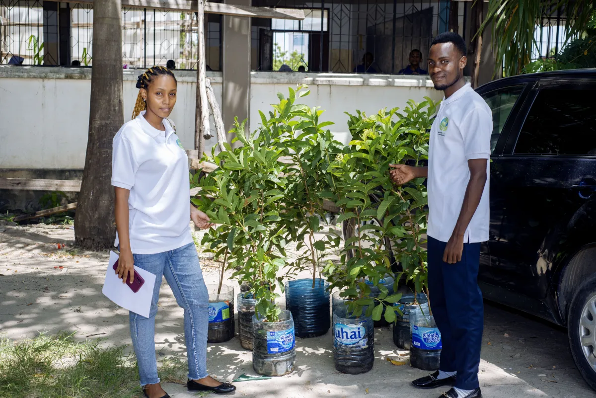 Young people taking part in a tree planting activity